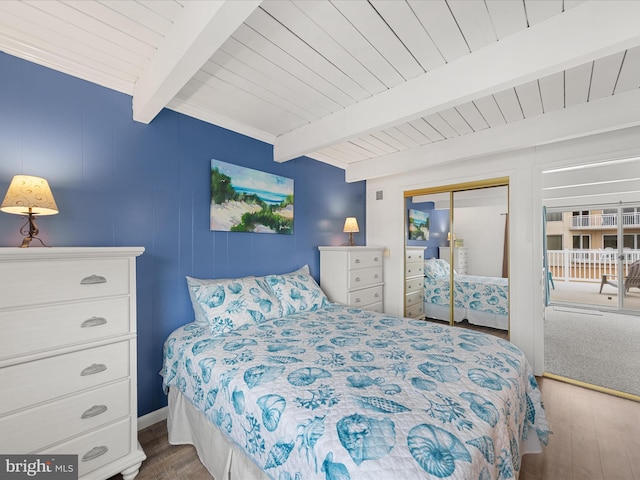 bedroom with wooden ceiling, a closet, beam ceiling, and wood finished floors