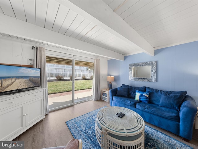 living room with wooden ceiling, wood finished floors, and beam ceiling