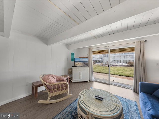 living area with wood ceiling, baseboards, beamed ceiling, and wood finished floors