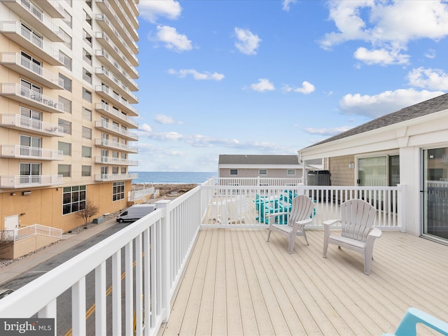 wooden terrace with a water view