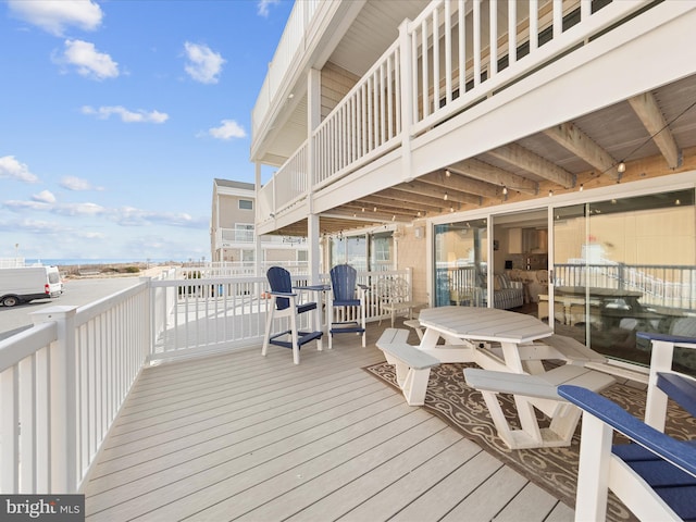 deck with outdoor dining space