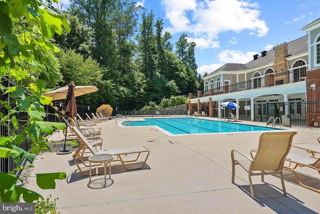 view of pool featuring a patio