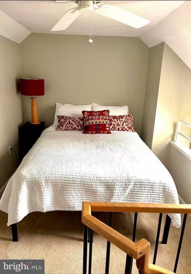 bedroom featuring ceiling fan, carpet, and vaulted ceiling