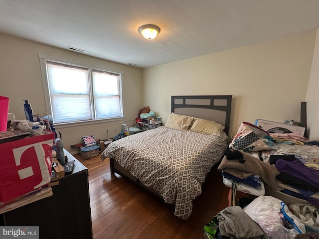 bedroom featuring dark hardwood / wood-style floors