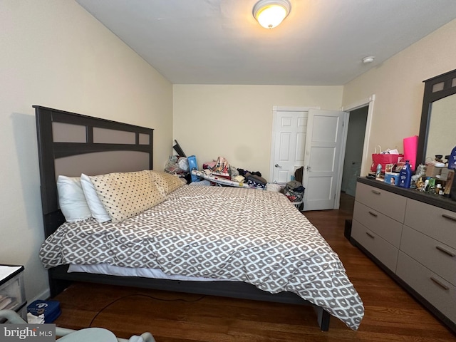 bedroom featuring dark hardwood / wood-style flooring