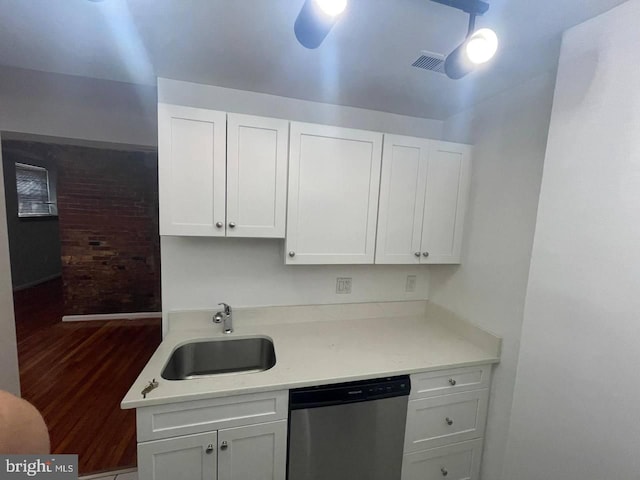 kitchen with ceiling fan, sink, stainless steel dishwasher, dark hardwood / wood-style floors, and white cabinets