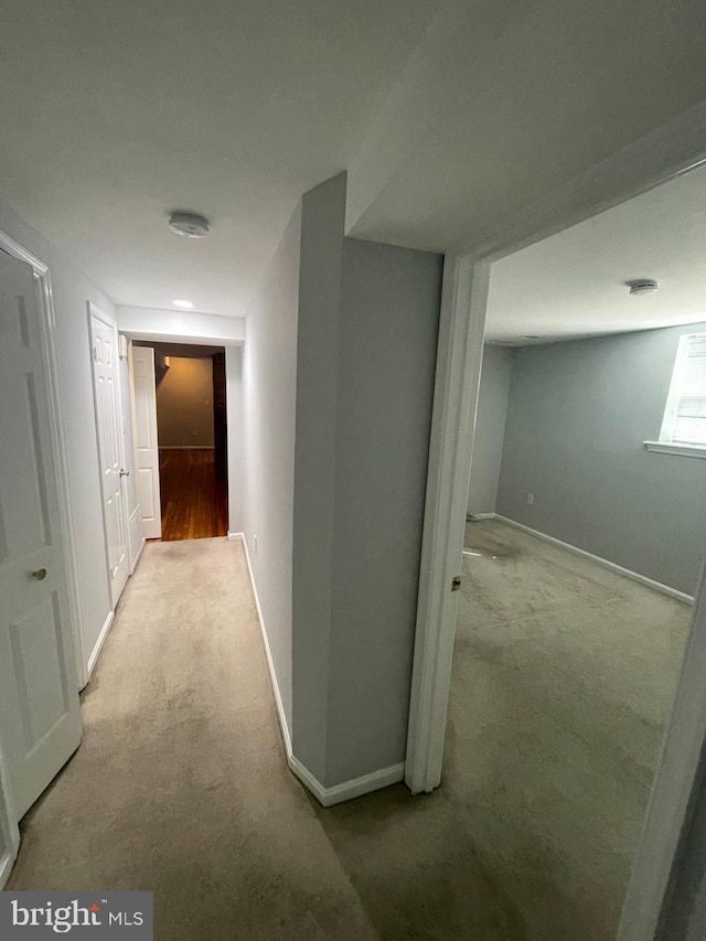 corridor with light colored carpet