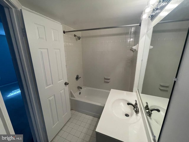 bathroom with vanity, tile patterned floors, and tiled shower / bath