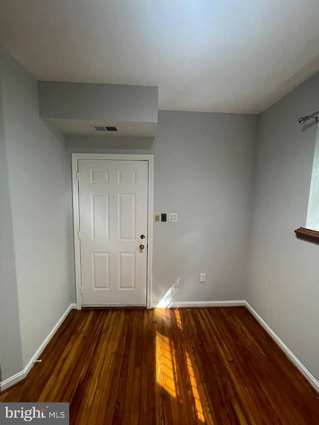 entrance foyer with dark hardwood / wood-style flooring