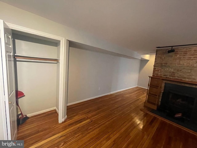 basement featuring dark hardwood / wood-style floors