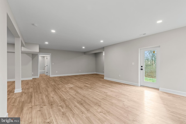 unfurnished living room featuring light wood-type flooring