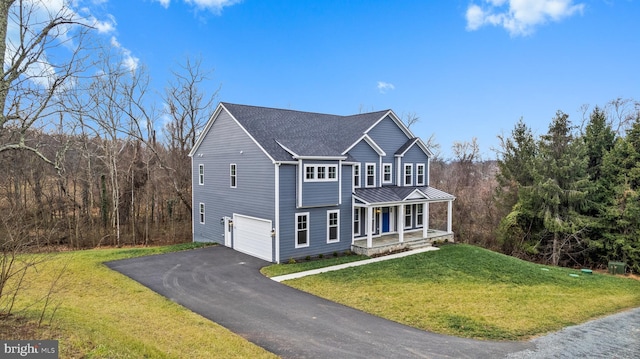 view of front of property featuring a porch, a garage, and a front yard