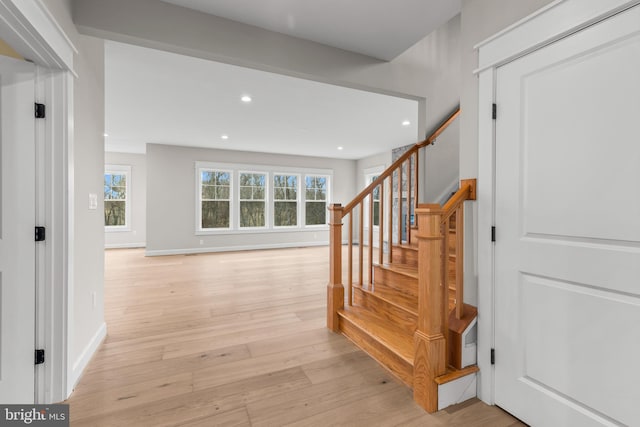 stairway featuring wood-type flooring