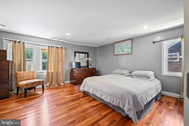 bedroom with hardwood / wood-style floors