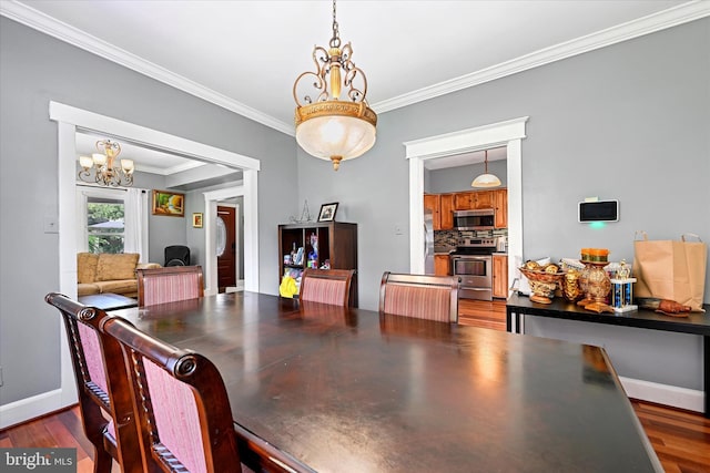 dining space with ornamental molding and dark hardwood / wood-style flooring