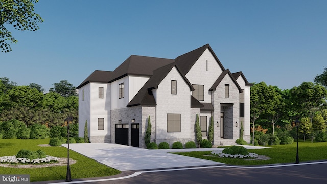 view of front of home with a front lawn and a garage