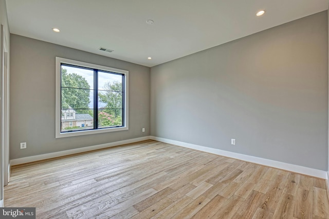 spare room featuring light wood-type flooring