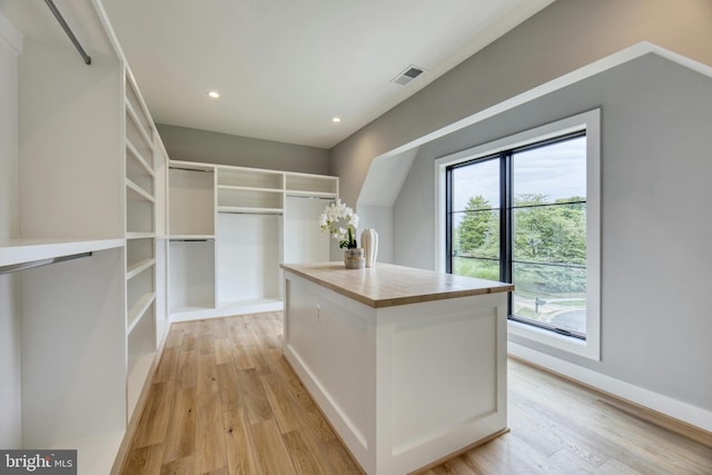 spacious closet featuring light hardwood / wood-style flooring