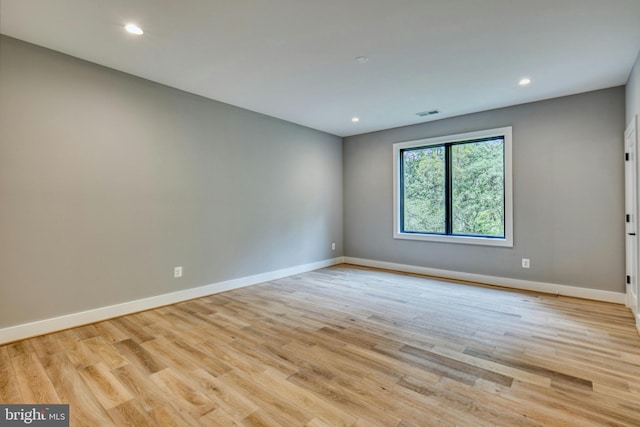 unfurnished room with light hardwood / wood-style flooring