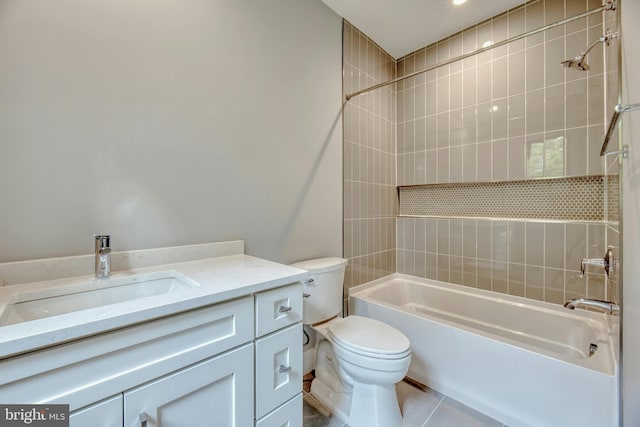 full bathroom featuring tile patterned floors, vanity, tiled shower / bath combo, and toilet