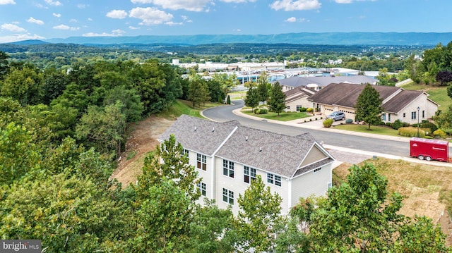 drone / aerial view featuring a mountain view