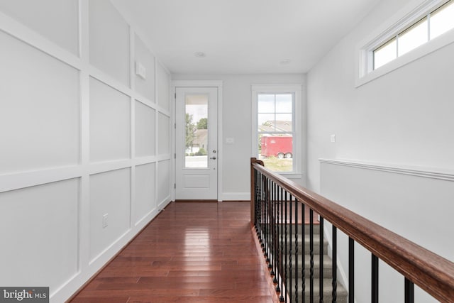 corridor with dark hardwood / wood-style floors