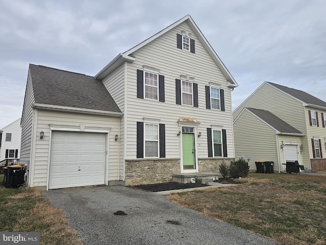 front of property with a garage