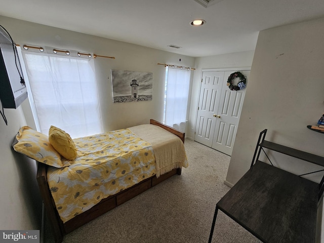 bedroom with carpet floors and a closet