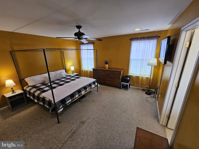 bedroom featuring light carpet and ceiling fan