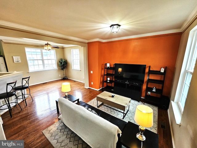 living room featuring hardwood / wood-style flooring, ceiling fan, and ornamental molding