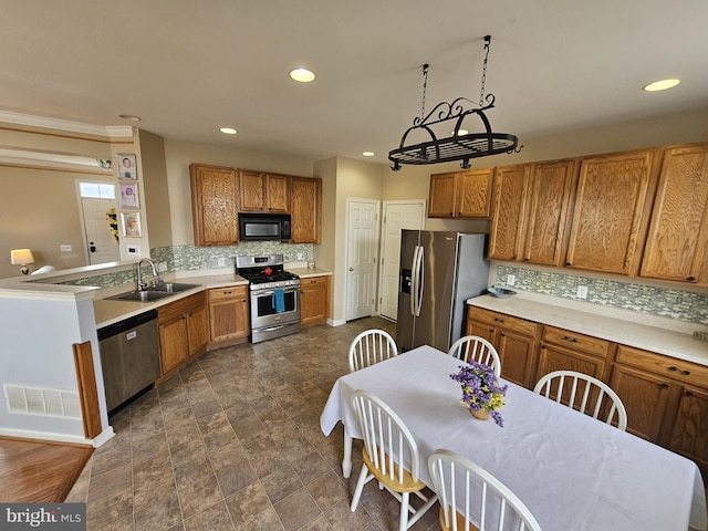 kitchen with tasteful backsplash, sink, and stainless steel appliances