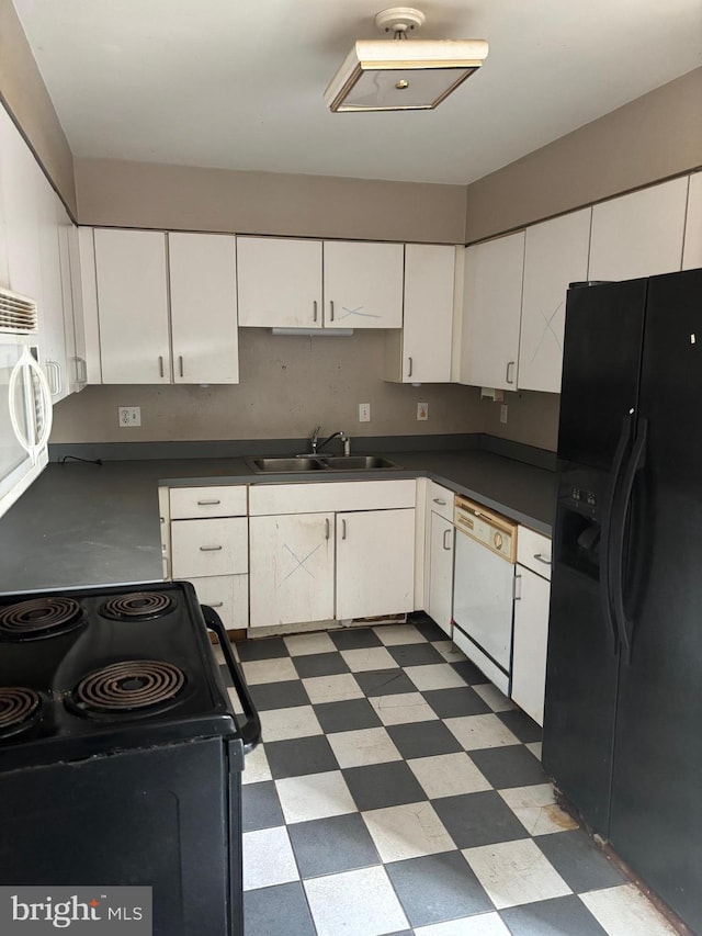 kitchen with sink, white cabinets, and black appliances