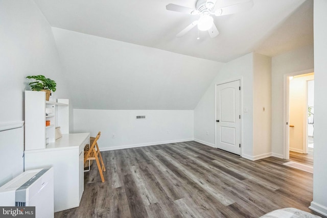 additional living space with ceiling fan, dark hardwood / wood-style flooring, and lofted ceiling