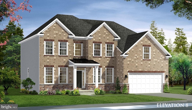 view of front of property with a front yard and a garage