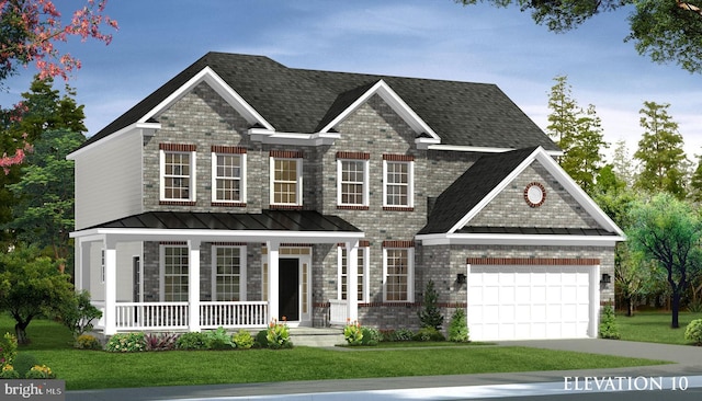 view of front of home featuring a front yard and a garage