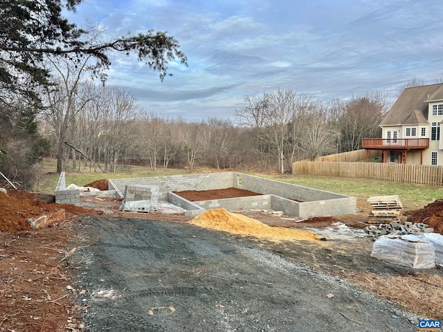 view of yard featuring a vegetable garden and fence