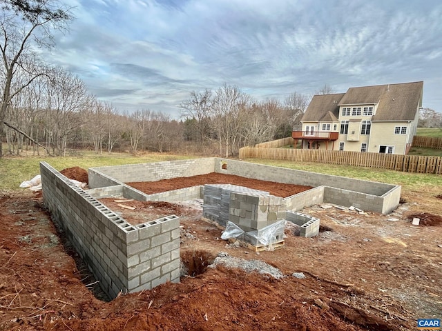 view of yard with fence and a garden