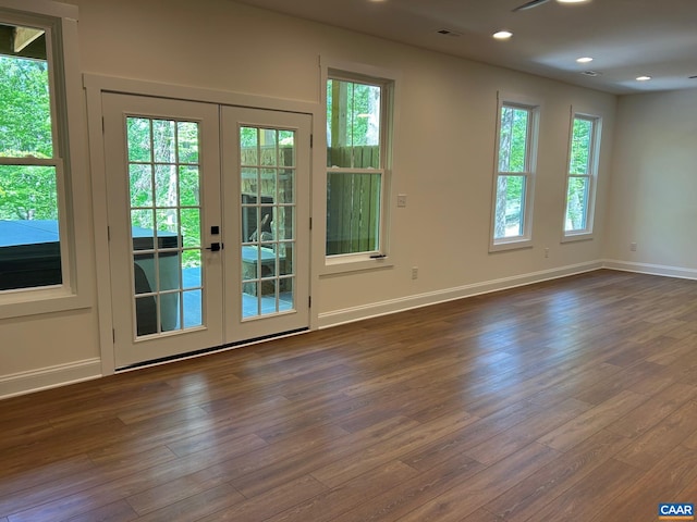 doorway with visible vents, dark wood finished floors, recessed lighting, french doors, and baseboards