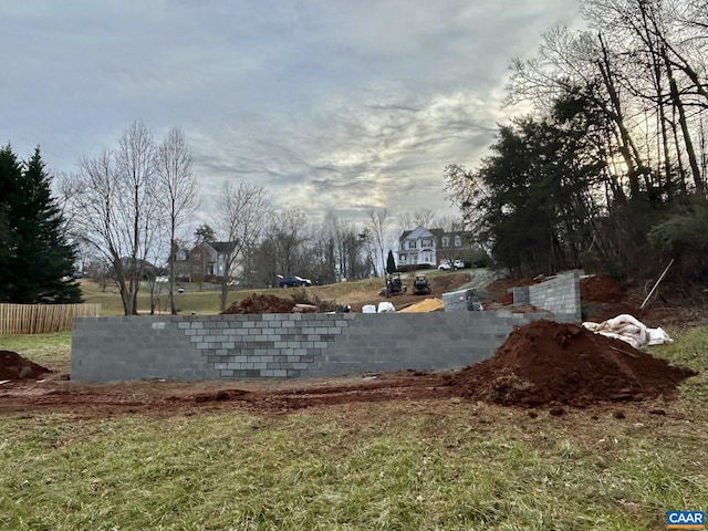 view of storm shelter featuring fence