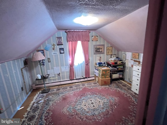 interior space featuring a textured ceiling, a baseboard radiator, and lofted ceiling