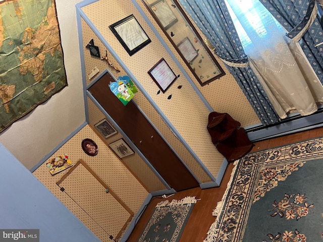 interior details featuring wood-type flooring and baseboard heating