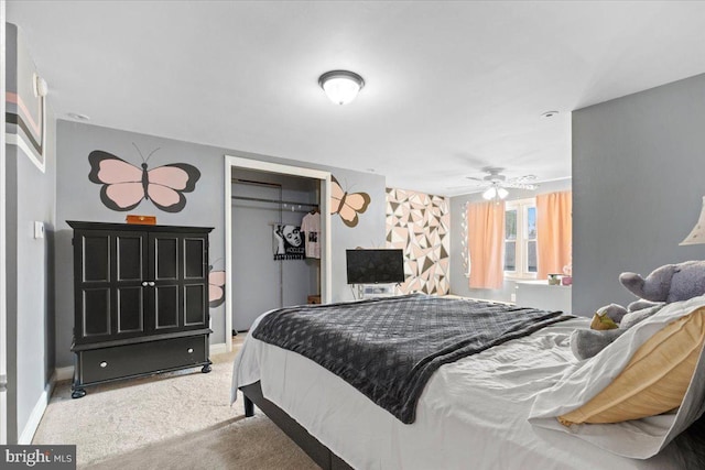 carpeted bedroom with a closet and ceiling fan