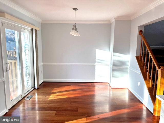 unfurnished room with dark hardwood / wood-style flooring and ornamental molding