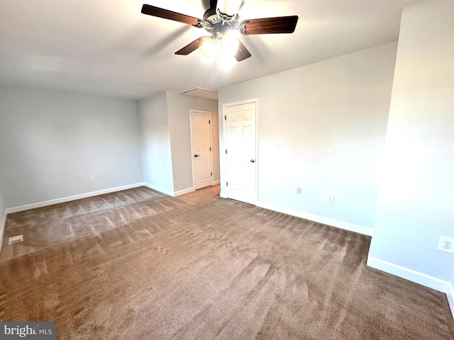 empty room with ceiling fan and carpet floors