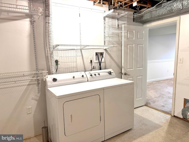 clothes washing area with independent washer and dryer