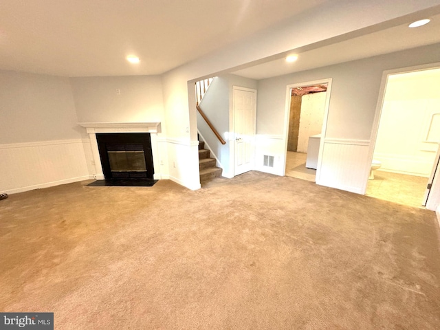 unfurnished living room with carpet flooring