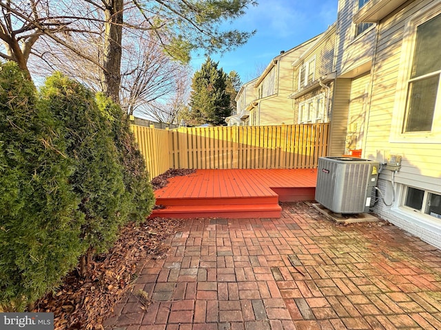 view of patio featuring central AC unit and a deck