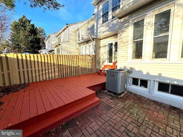 deck with a patio area and central air condition unit