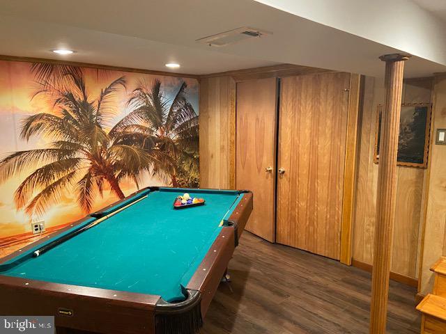 playroom featuring wooden walls, dark hardwood / wood-style floors, ornate columns, and pool table