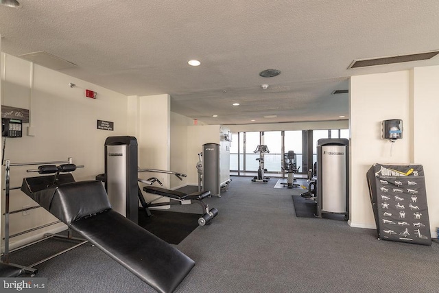 workout area with a textured ceiling